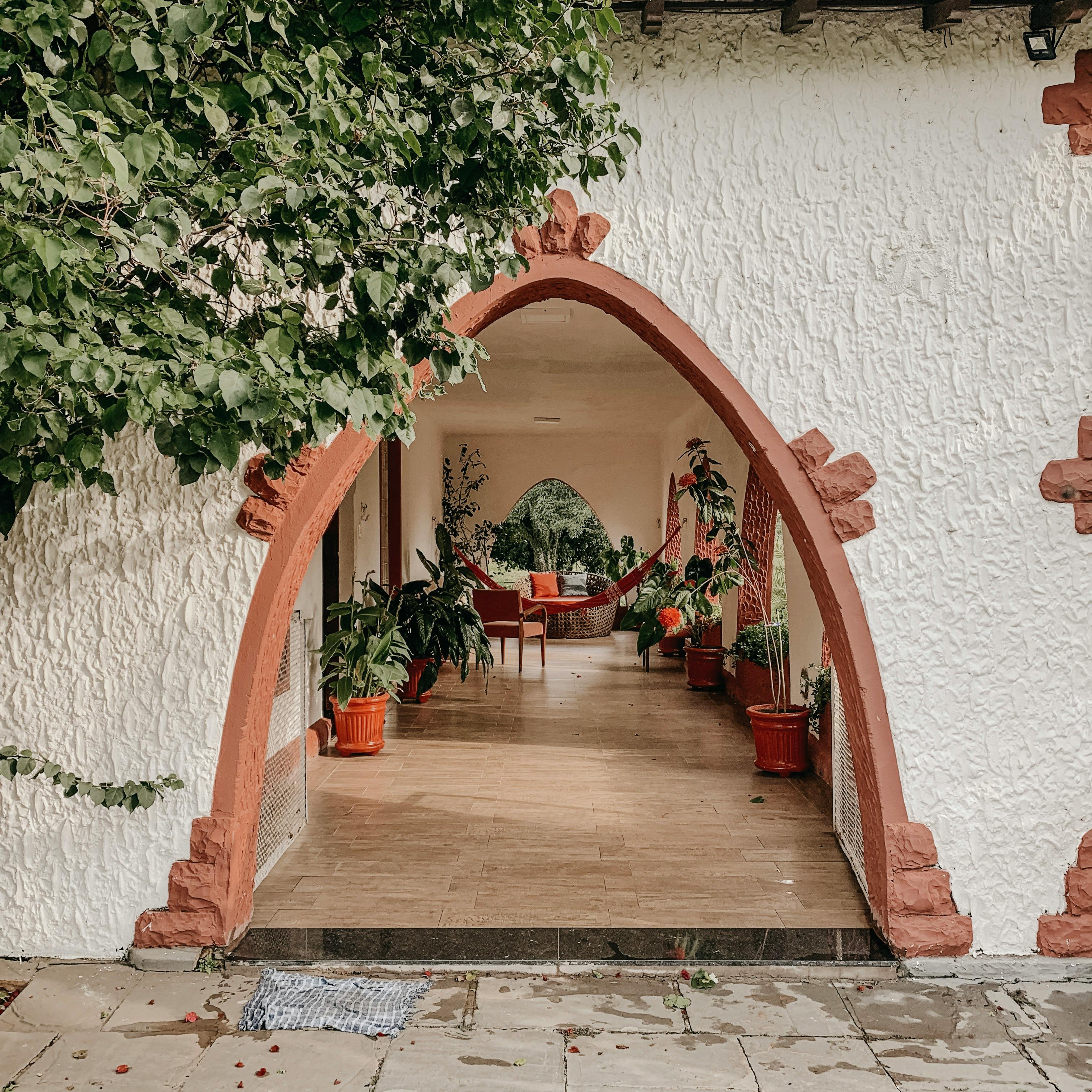 Moroccan riad courtyard with arches, warm lanterns and boutique travel mood