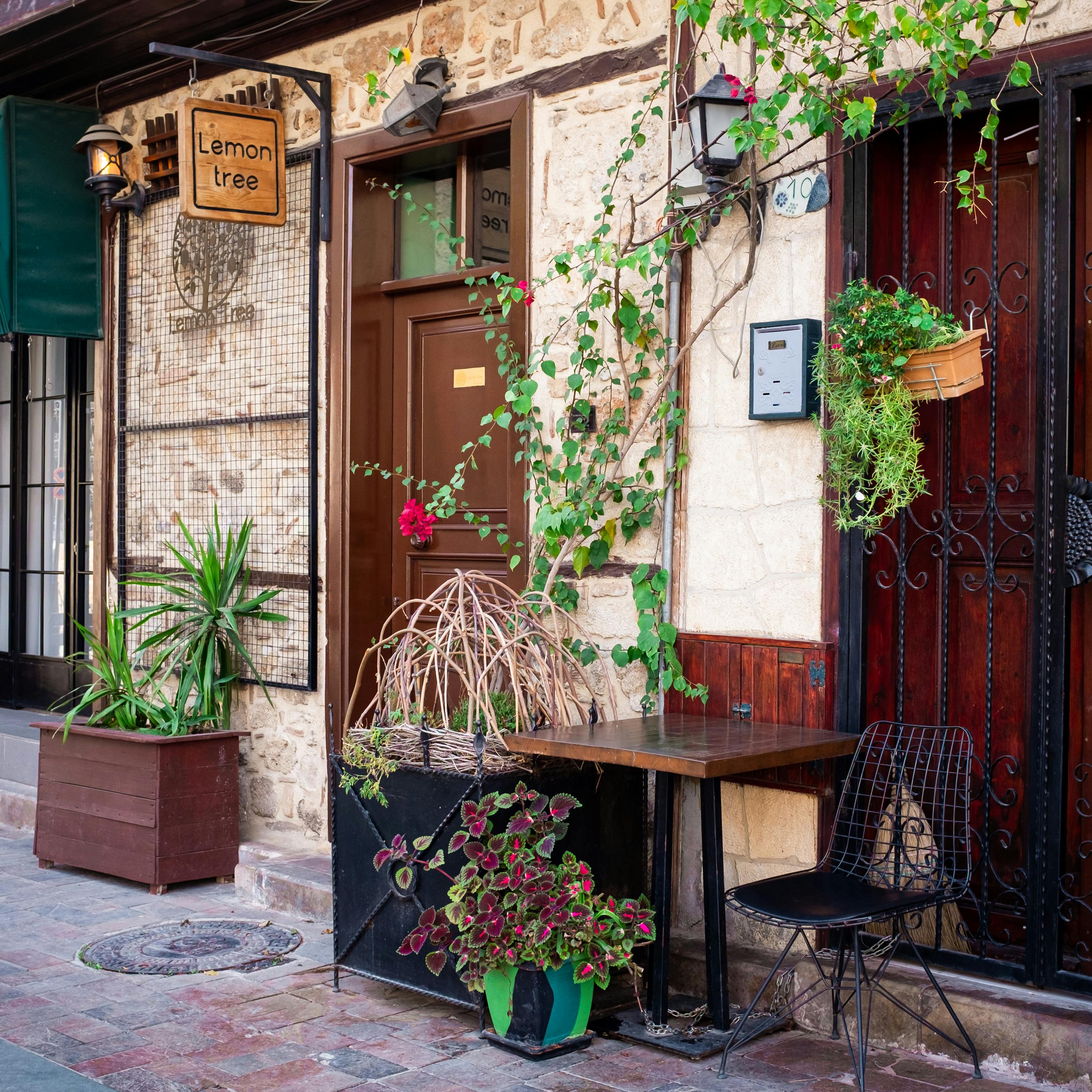 Provence market street with baskets, flowers and boutique hotel doorway